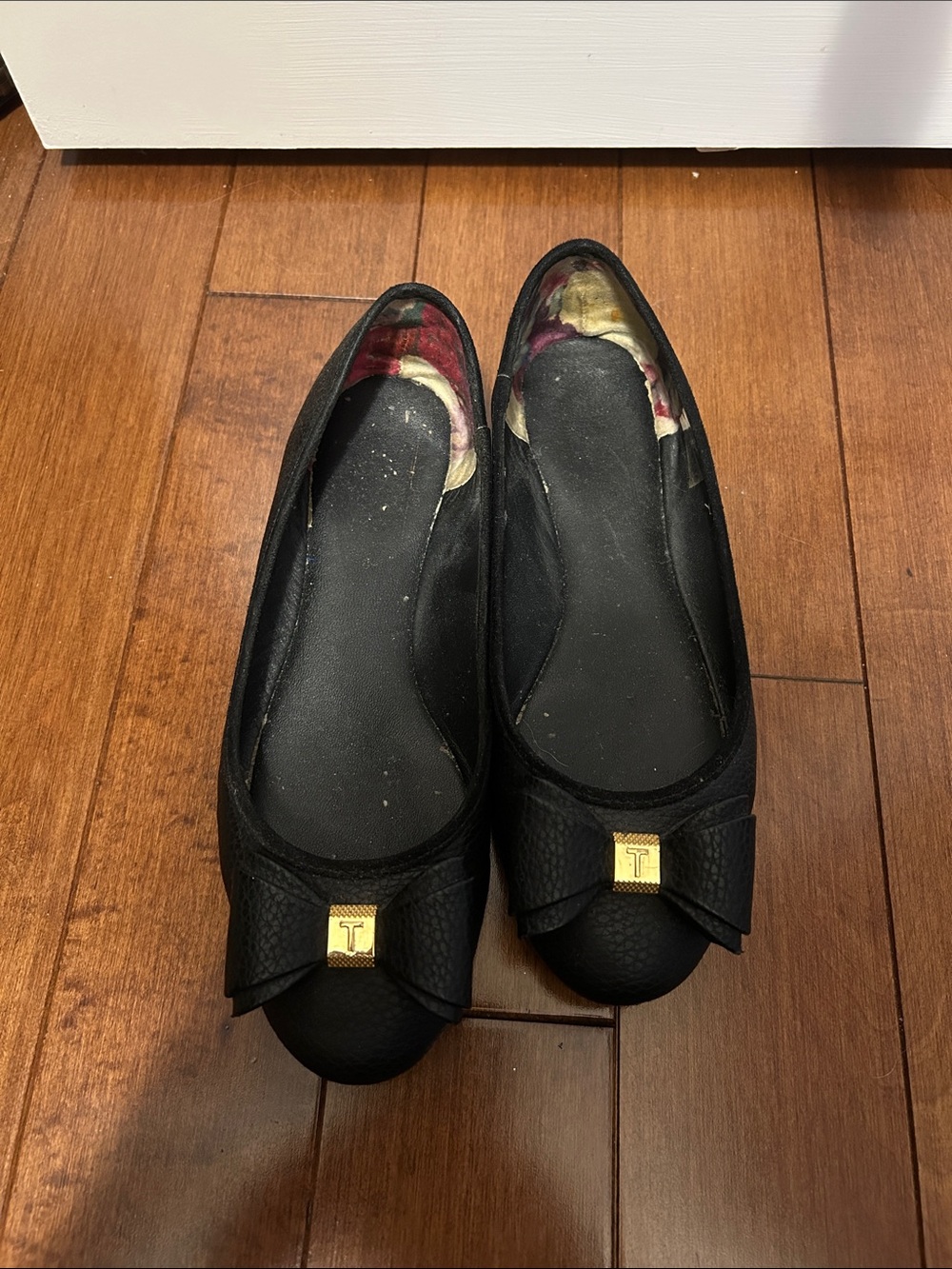 Ted Baker Black Ballet Flats with Bow and Gold-Tone Logo